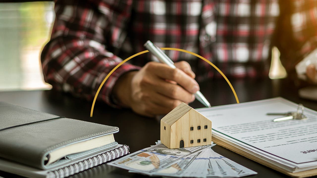 Insurance professional and homeowner reviewing policy coverage together