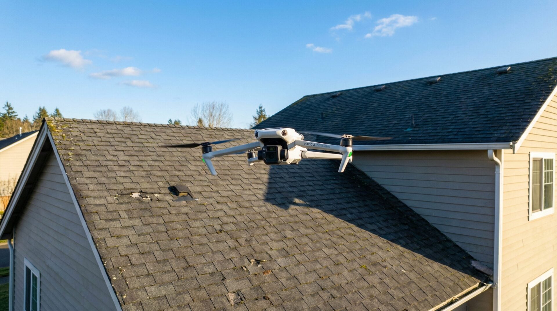 Professional drone capturing roof inspection data